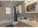Bathroom featuring tile floors, shower, and storage cabinet at 2104 E Navajo Ave, Tampa, FL 33612