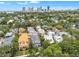 Aerial neighborhood view showing mature trees with city skyline as a backdrop at 221 13Th Ne Ave, St Petersburg, FL 33701