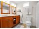 Bathroom featuring double vanity, ample counterspace, tile flooring, and a large window to brighten the space at 221 13Th Ne Ave, St Petersburg, FL 33701