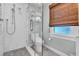 Bathroom featuring a marble vanity top, glass shower and honeycomb tile floors at 221 13Th Ne Ave, St Petersburg, FL 33701