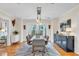 Spacious dining room with stylish lighting and easy access to the patio, ideal for gatherings and entertaining at 221 13Th Ne Ave, St Petersburg, FL 33701