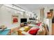 Bright living room with large windows, comfortable seating, and hardwood floors that enhance the charm at 221 13Th Ne Ave, St Petersburg, FL 33701