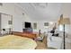 Bright main bedroom featuring vaulted ceilings, a comfortable seating area, and wood flooring that enhances the charm at 221 13Th Ne Ave, St Petersburg, FL 33701