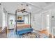 Bright main bedroom featuring a four-poster bed, area rug and ample natural light at 221 13Th Ne Ave, St Petersburg, FL 33701