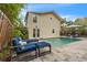 Backyard with a refreshing pool, outdoor seating, and beautiful landscaping, perfect for entertaining at 221 13Th Ne Ave, St Petersburg, FL 33701
