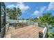 Backyard deck with scenic water views, ideal for relaxing and enjoying the outdoors at 2632 Tung Dr, Holiday, FL 34691