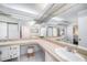 Bathroom featuring double sinks, makeup vanity and ample lighting at 2632 Tung Dr, Holiday, FL 34691