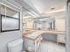 Bathroom featuring double sinks, makeup vanity and ample lighting at 2632 Tung Dr, Holiday, FL 34691