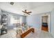 Dining area featuring a glass table and a ceiling fan at 2632 Tung Dr, Holiday, FL 34691