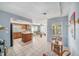 Eat-in kitchen that features tile flooring, wooden cabinets, and breakfast bar at 2632 Tung Dr, Holiday, FL 34691