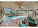 Inviting screened-in pool area perfect for relaxation and outdoor entertainment with a covered ceiling at 2632 Tung Dr, Holiday, FL 34691