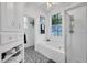 This bathroom features a soaking tub, walk-in shower, and decorative floors at 2712 Spring Meadow Dr, Plant City, FL 33566