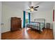 This bedroom features hardwood floors and natural lighting at 2712 Spring Meadow Dr, Plant City, FL 33566