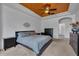 This bedroom features a unique copper ceiling and an ensuite bathroom at 2712 Spring Meadow Dr, Plant City, FL 33566