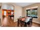 Inviting dining room adjacent to the game room and pool view, creating a perfect entertainment space at 2712 Spring Meadow Dr, Plant City, FL 33566