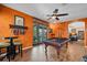 Vibrant game room with a pool table, accent lighting, and access to the outdoor entertainment area at 2712 Spring Meadow Dr, Plant City, FL 33566