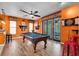 Recreation area showcasing a pool table, dartboard, and easy access to the outdoor patio area at 2712 Spring Meadow Dr, Plant City, FL 33566