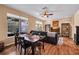 Inviting living room featuring wood floors, comfortable seating, and ample natural light from large windows at 2712 Spring Meadow Dr, Plant City, FL 33566