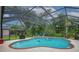 A clear view of the inviting pool, with an attached hot tub, and shady, wooded surrounding at 2712 Spring Meadow Dr, Plant City, FL 33566
