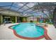 Beautiful swimming pool and hot tub with brick border is encased in screened enclosure at 2712 Spring Meadow Dr, Plant City, FL 33566