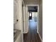 Hallway showing the washer/dryer, with a view to the living room and sunroom at 2753 Countryside Blvd # 107, Clearwater, FL 33761