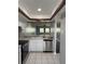 Functional kitchen with stainless steel appliances, recessed lights, and easy access to adjacent room at 2753 Countryside Blvd # 107, Clearwater, FL 33761
