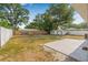 Large backyard featuring a shed and a concrete patio at 2858 State Road 590, Clearwater, FL 33759