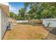 Spacious backyard with a shed, mature trees, and plenty of room to relax at 2858 State Road 590, Clearwater, FL 33759