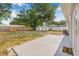 Large backyard with a concrete patio, shed, and plenty of room for activities at 2858 State Road 590, Clearwater, FL 33759