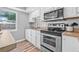 Bright kitchen featuring stainless steel appliances and ample counter space at 2858 State Road 590, Clearwater, FL 33759