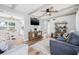 Inviting living room featuring wood beam ceilings, wood floors, and stylish furnishings at 2858 State Road 590, Clearwater, FL 33759