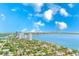 Expansive aerial view showcasing waterfront homes and condos, with city skyline backdrop at 2936 W Knights Ave # A, Tampa, FL 33611