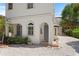 Inviting entryway with stone path, garden, and arched doorway leading to the home at 2936 W Knights Ave # A, Tampa, FL 33611