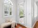 Bright entryway featuring a bench, natural light and wood floors at 2936 W Knights Ave # A, Tampa, FL 33611