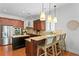 Gourmet kitchen boasts stainless steel appliances, granite countertops, and an island bar at 2936 W Knights Ave # A, Tampa, FL 33611