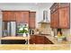 Gourmet kitchen boasts stainless steel appliances, granite countertops, and custom cabinets at 2936 W Knights Ave # A, Tampa, FL 33611