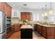 Gourmet kitchen boasts stainless steel appliances, granite countertops, and island with seating at 2936 W Knights Ave # A, Tampa, FL 33611