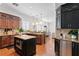 Gourmet kitchen boasts stainless steel appliances, granite countertops, and kitchen island at 2936 W Knights Ave # A, Tampa, FL 33611