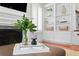Bright living area showcasing custom built-ins, a fireplace, and stylish decor at 2936 W Knights Ave # A, Tampa, FL 33611