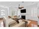 Spacious living area with fireplace, plantation shutters, hardwood floors, and comfortable seating at 2936 W Knights Ave # A, Tampa, FL 33611