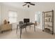 Home office with a sleek black desk, minimalist decor, and natural light at 2936 W Knights Ave # A, Tampa, FL 33611