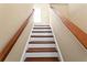 A carpeted stairway with wooden rails at 2936 W Knights Ave # A, Tampa, FL 33611