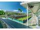 Outdoor bocce ball court with seating, green turf, and covered canopy for shade for a pleasant game at 2960 59Th S St # 614, Gulfport, FL 33707