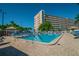 Community outdoor pool with lounge chairs and manicured landscaping, offering a resort-like atmosphere at 2960 59Th S St # 614, Gulfport, FL 33707