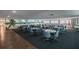 Large community room with tables, chairs, and a beach-themed mural, ideal for gatherings at 2960 59Th S St # 614, Gulfport, FL 33707