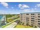 Building exterior with a marina view, green space, and cloudscape at 2960 59Th S St # 614, Gulfport, FL 33707