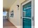 Condo front door with modern door hardware, unit number, and view of city skyline at 2960 59Th S St # 614, Gulfport, FL 33707