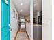 Bright hallway leading to living spaces with hardwood floors, and neutral decor at 2960 59Th S St # 614, Gulfport, FL 33707