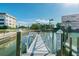 Dock and kayak launch with a sign, featuring waterfront access and clear blue skies at 2960 59Th S St # 614, Gulfport, FL 33707