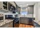 Updated kitchen with stainless steel appliances, granite countertops, and tiled backsplash at 2960 59Th S St # 614, Gulfport, FL 33707